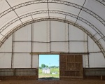 Inside the riding arena with the new fabric cover